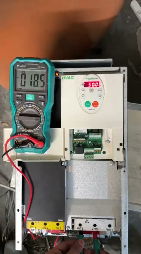 Nexa engineering support technician testing a variable frequency drive